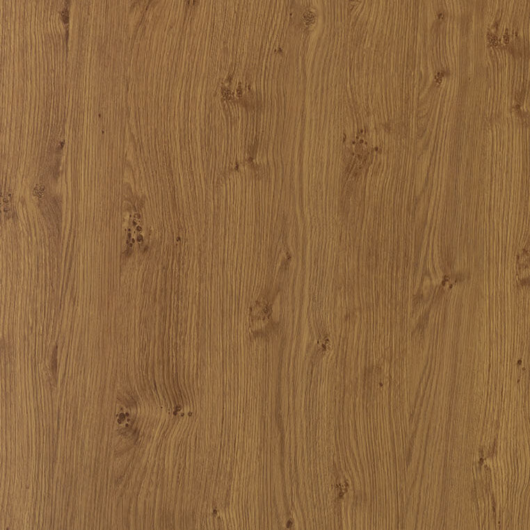 A close-up of a wooden surface with a light brown, natural wood grain pattern. The texture displays various knots and lines, creating an organic and rustic appearance. The wood surface appears smooth and polished.